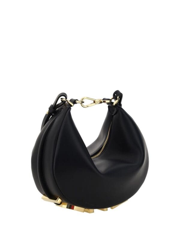 Lux Brands black leather handbag with gold accents and a distinctive chunky sole design.