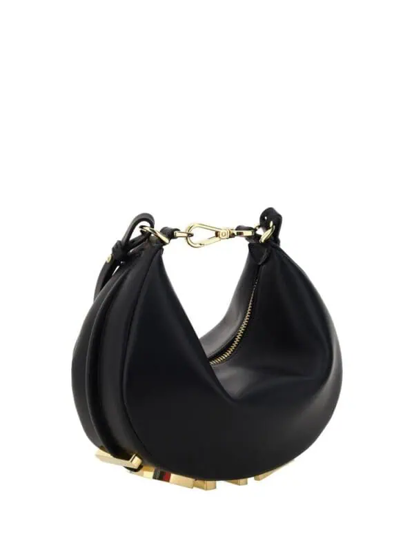 Lux Brands black leather handbag with gold accents and a distinctive chunky sole design.