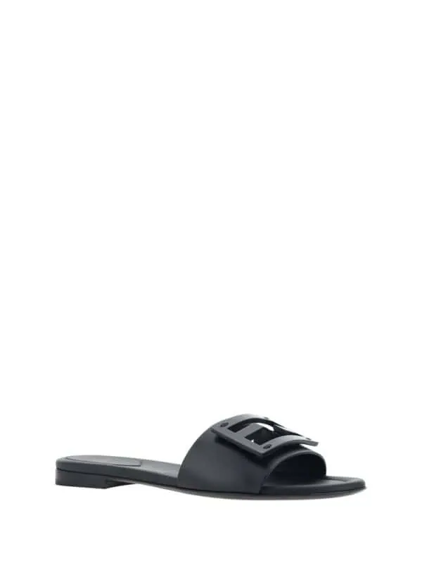 Elegant black designer slide sandal with buckle detail, perfect for casual luxury wear and summer outfits. Stylish and comfortable footwear from Lux Brands.