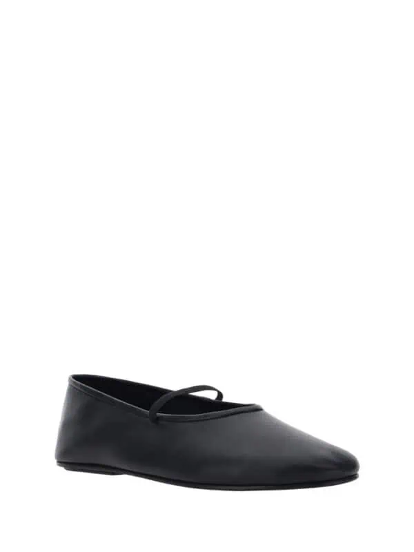 Elegant black ballet flat shoe with a simple strap design, perfect for stylish everyday wear.