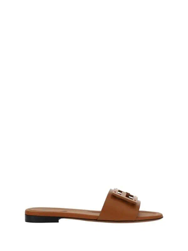 Brown slide sandal with decorative buckle, perfect for casual luxury summer style.