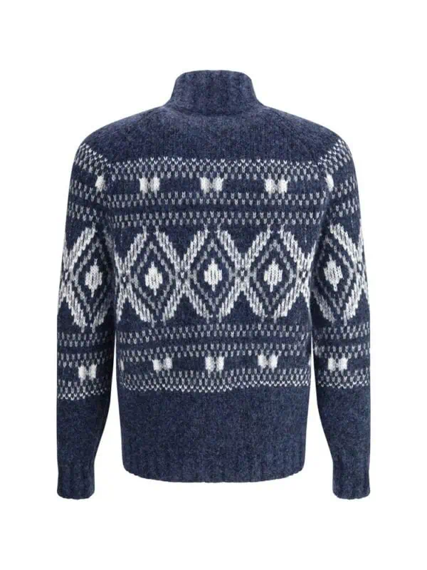 Cozy navy blue and white patterned knit sweater with Arctic-inspired design, high neckline, and comfortable fit, perfect for winter fashion statements.