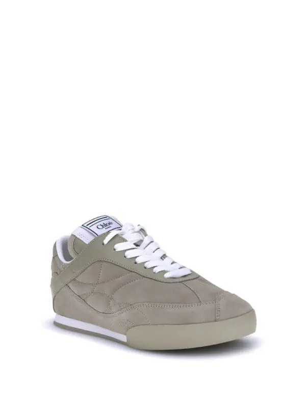 Beige designer sneakers with white laces and sole, stylish and comfortable footwear for casual or sporty occasions. Perfect for adding a luxury touch to everyday outfits.