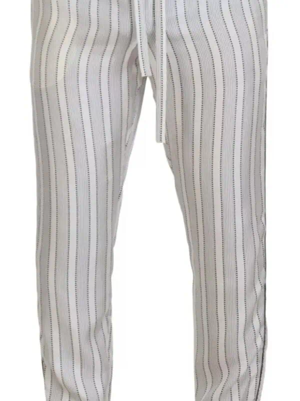 Comfy white and black striped jogger pants with drawstring waist, stylish loungewear for men and women comfortable fit and modern design perfect for relaxing or casual outings.