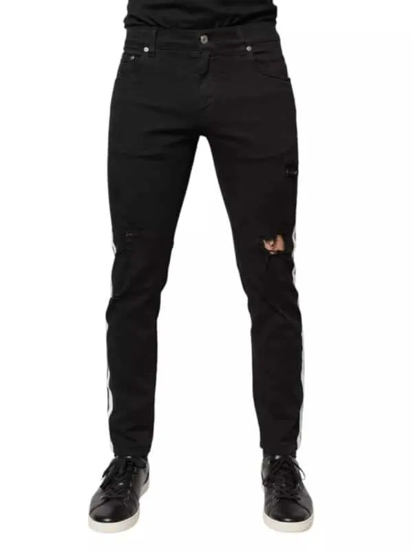 Black ripped distressed skinny jeans with white side stripes, stylish and trendy for casual, streetwear, and fashion-forward looks. Perfect for a modern, edgy wardrobe.